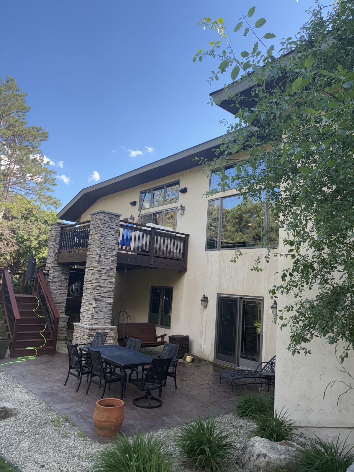 Exterior of a Twin Cities home with a freshly cleaned paver patio and siding