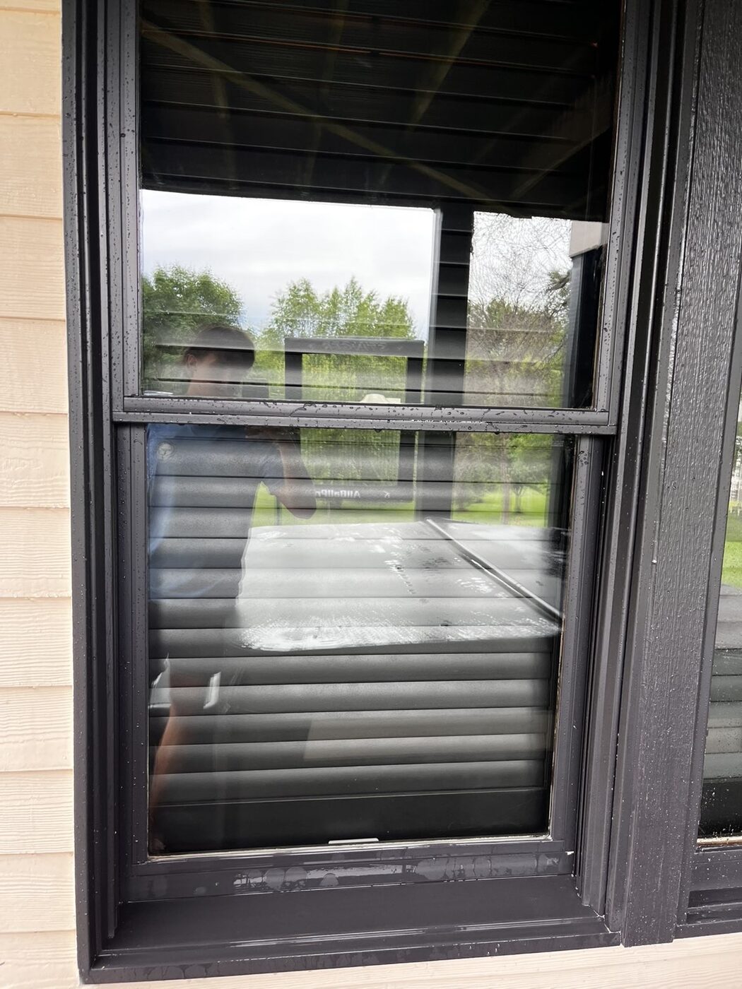 The same window cleaned to a streak-free, crystal-clear finish